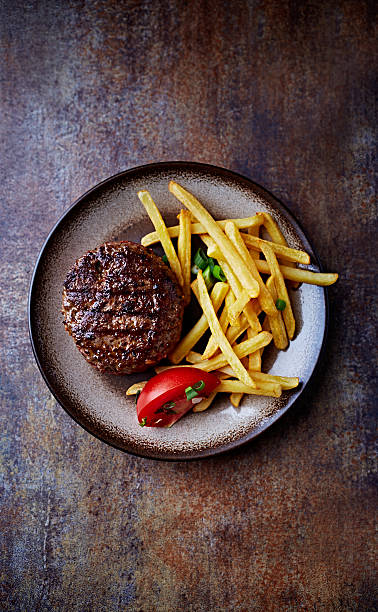 Grilled Burger with French Fries grilled burger with french fries on a plate salisbury steak stock pictures, royalty-free photos & images