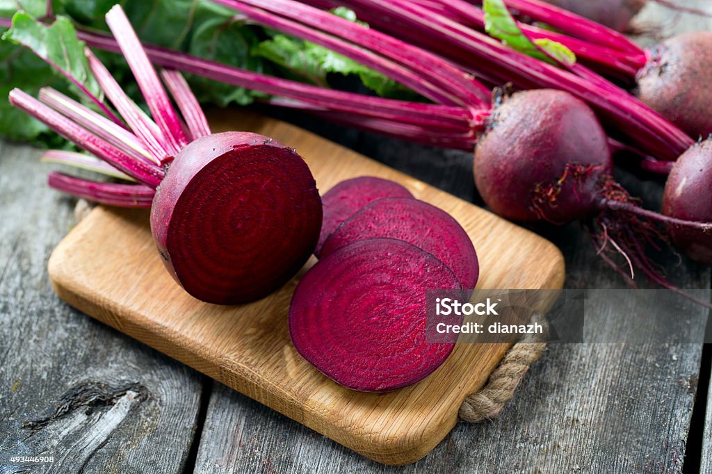 fresh sliced beetroot on wooden surface Beet Stock Photo