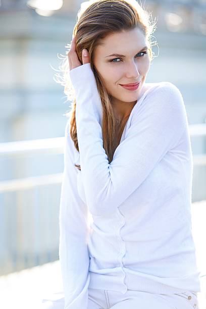 istock Beautiful woman touching her hair 493447007