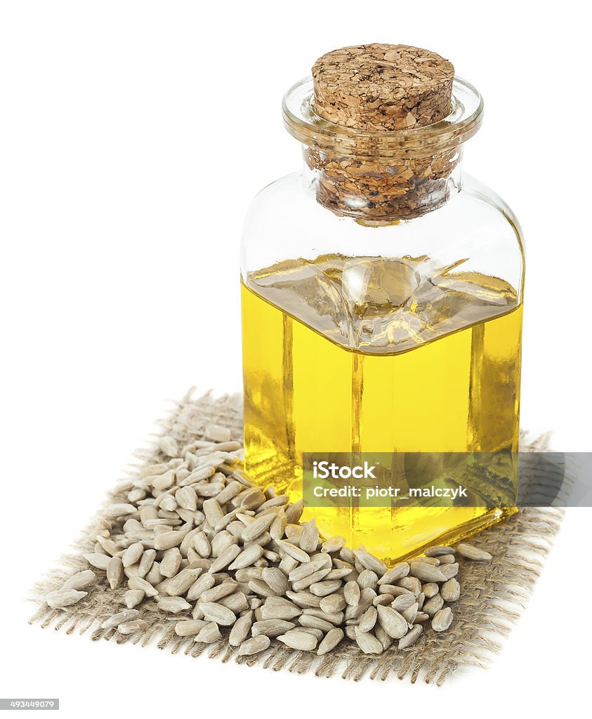 Sunflower oil Sunflower oil and sunflower seeds  isolated on white background Bottle Stock Photo