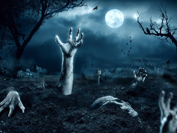 istock Zombie hand coming out of his grave 493449527