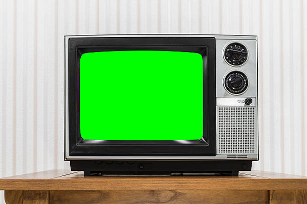 istock Old Portable Television on Wood Table with Chroma Screen 493471282