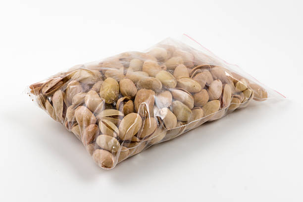 istock transparent plastic package full of dry pistachios 493471316