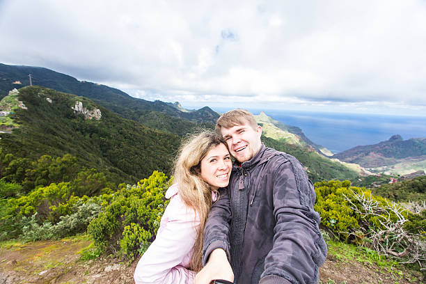istock Couple taking self-portrait picture 493474560