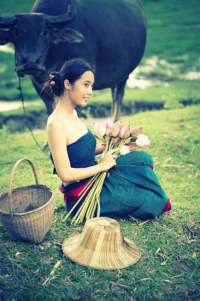 istock thai ancient young women with buffalo on rural 493480962