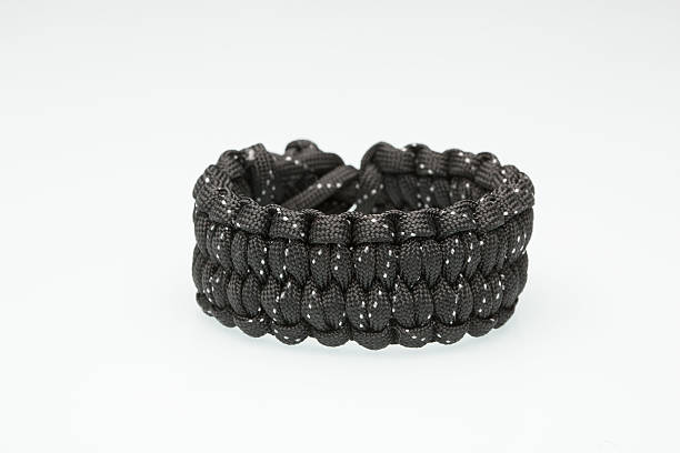 istock Black braided bracelet on white background 493481374