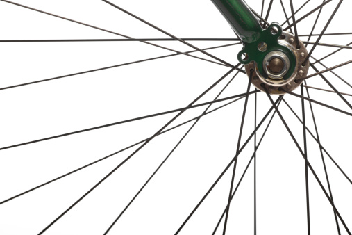 Color detail of the wheel of a bicycle, with spokes.