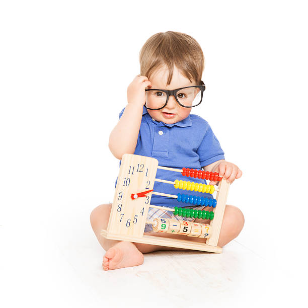 istock Boy child abacus clock in glasses, smart little kid 493500537