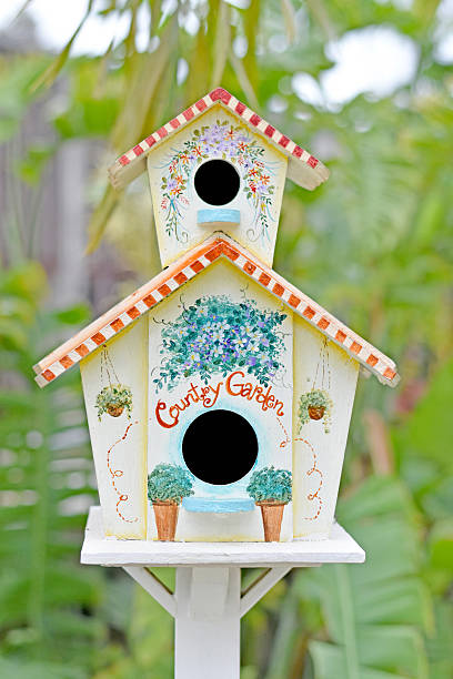istock Beautiful bird house in a lush garden 493502014