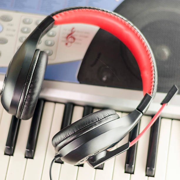 istock headphones on electric piano keyboard 493505757