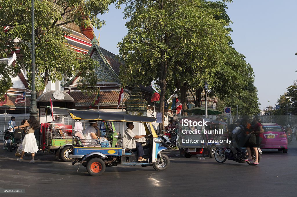 Bangkok tuk-tuk taxi in traffic - Thailand Bangkok, Thailand - March 4, 2014: Tuk-tuk taxi in early evening traffic in the Phra Nakhon district of the city. Bangkok Stock Photo