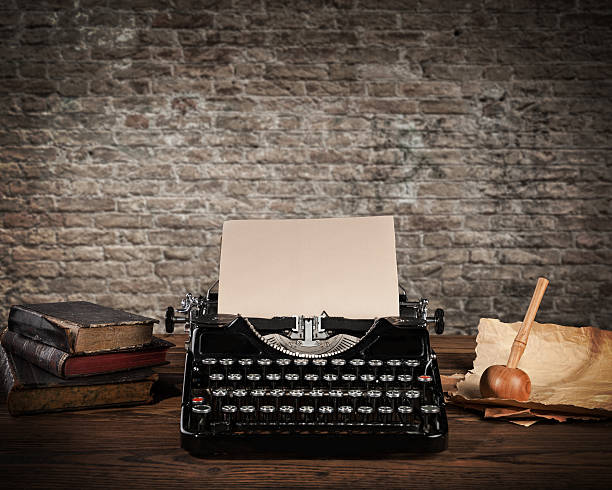 istock Antique typewriter with grungy brick wall 493507266