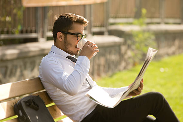 istock Businessman drinking coffee outdoors 493508366