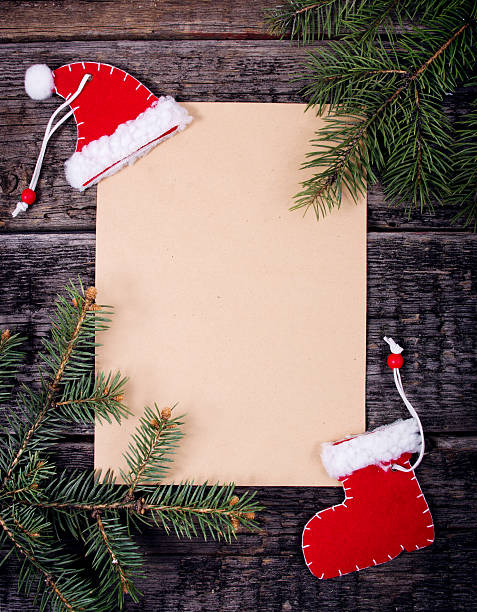 istock Card with Christmas decorations on wooden background 493510378
