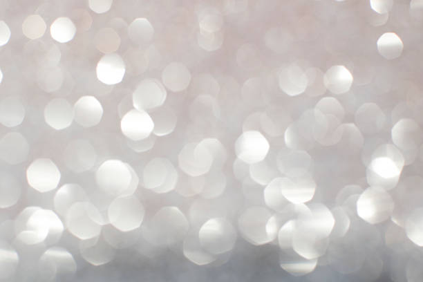 istock Silver white glittering Christmas lights. Blurred abstract backg 493510914
