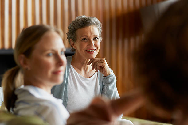 women spending leisure time at home - nur frauen über 40 stock-fotos und bilder