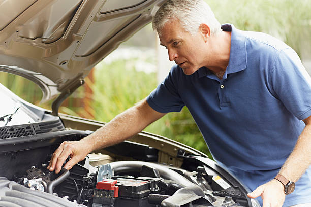 man fixing his car engine - engine car hood repairing ストックフォトと画像