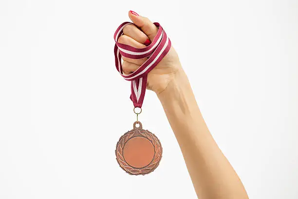 Photo of Person holding a medal