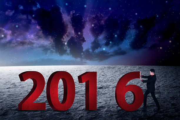 Business person push number 6, so it become 2016. Happy new year concept