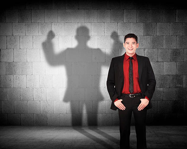 istock Asian business man casting a strong man shadow 493512690