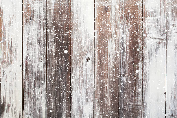 istock Christmas background with falling snow over wooden background 493514364