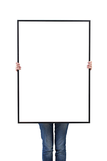 istock woman holding blank poster in hand. 493514634