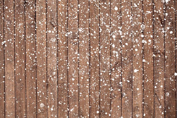 istock Christmas background with falling snow over wooden background 493514948