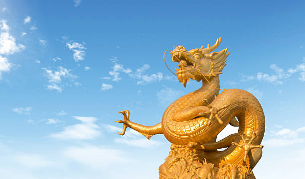 istock golden dragon statue at in the sky background 493515122