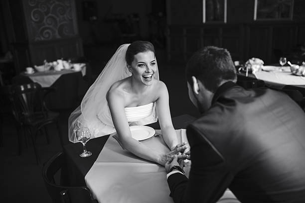 istock bride and groom holding hands 493516118