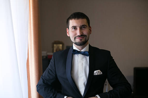 istock groom in the morning getting ready 493516186