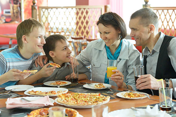 istock Family eating pizza 493530178