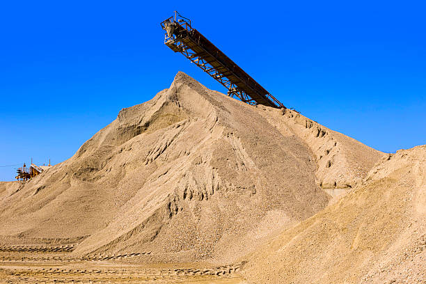 gravel pit conveyor at the gravel pit with gravel mountain shovel in sand stock pictures, royalty-free photos & images