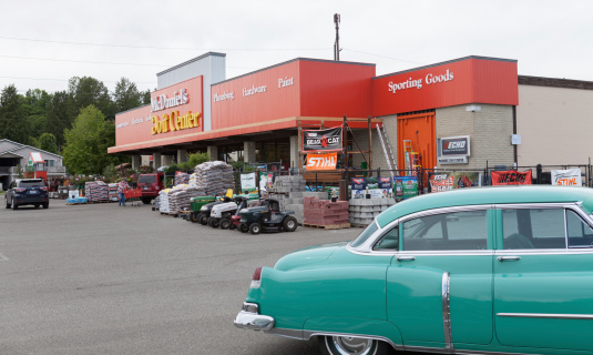 Snohomish, United States - May 22, 2014: This image shows McDaniel's Do-It Center hardware store in Snohomish, Washington State. You can see products on display in front of the store. There is a 1950's car parked in the parking lot at the store.