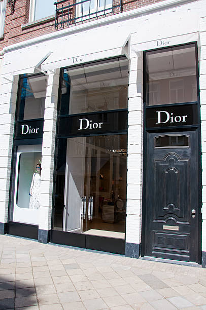 Dior store in the P.C.Hooftstraat shopping street on in Amsterdam. Amsterdam, the Netherlands - April 30, 2015: Dior store in the P.C.Hooftstraat shopping street. victoria beckham stock pictures, royalty-free photos & images