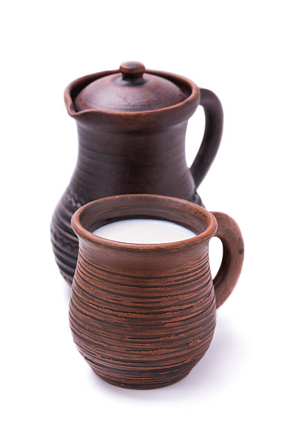 kitchen utensils, dishes on the table. jug and mug close-up.