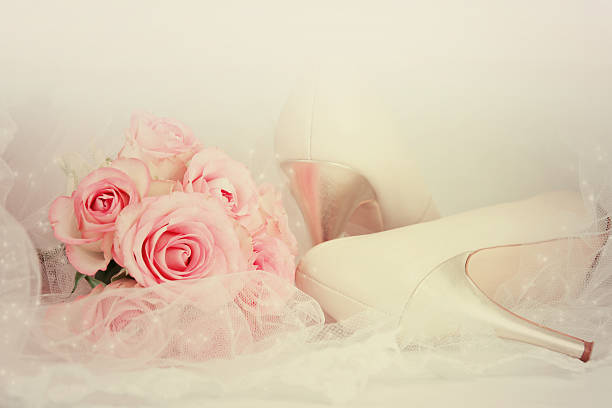 istock Wedding Day concept with roses and bridal shoes. 493534010