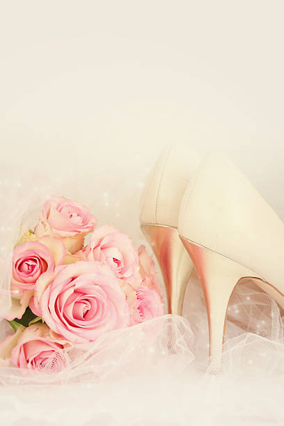 istock Wedding Day concept with roses and bridal shoes. 493534074