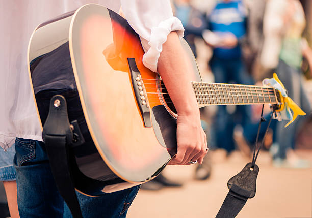 istock guitarist on a street 493534815