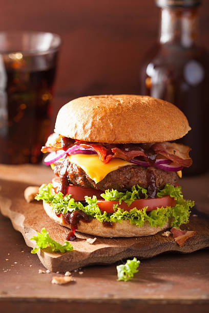 istock bacon cheese burger with beef patty tomato onion 493534964