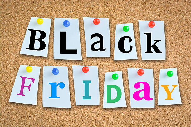 istock Black Friday sales text with wooden billboard and pins 493536680