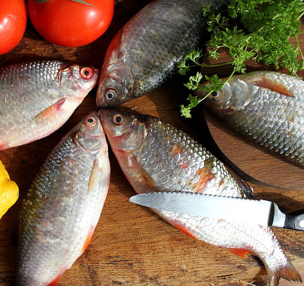 istock small fish on wooden background 493537213
