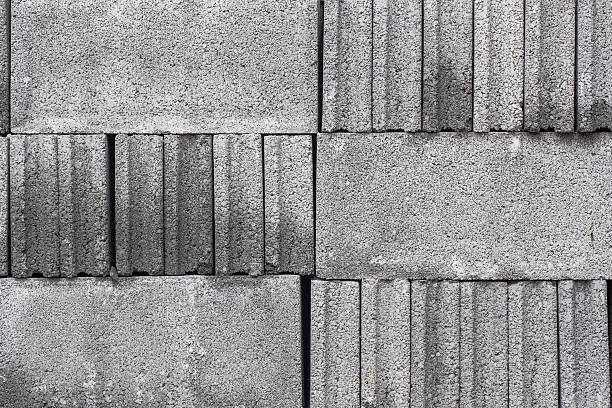 brick block - hollow gray pattern wall photos et images de collection