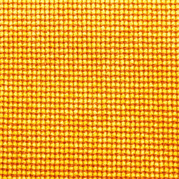 istock Seamless yellow colored fabric-textured background 493537402