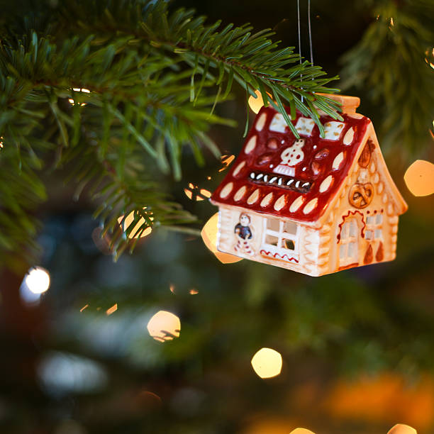 istock House shape bauble on the christmas tree 493537590