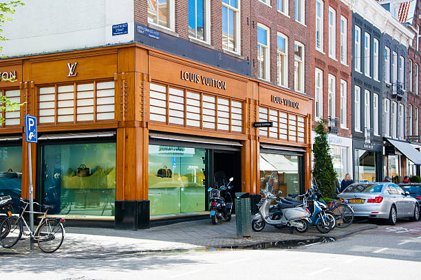 Louis Vuitton store on the P.C.Hooftstraat shopping street in Amsterdam. Amsterdam, the Netherlands - April 30, 2015:  Louis Vuitton store on the P.C.Hooftstraat shopping street , people on the street. victoria beckham stock pictures, royalty-free photos & images