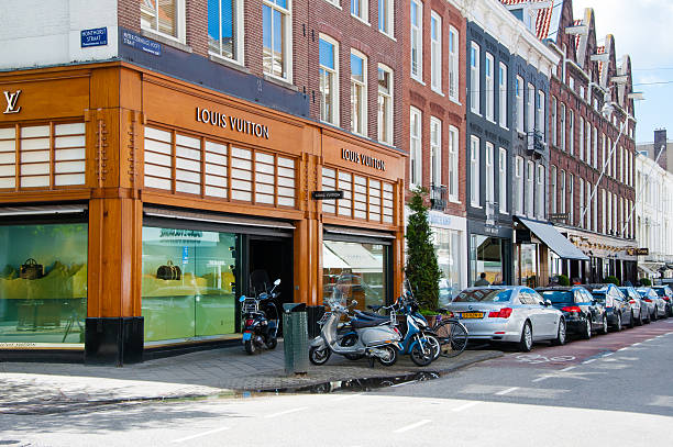 Louis Vuitton store on the P.C.Hooftstraat shopping street, the Netherlands. Amsterdam, the Netherlands - April 30, 2015: Louis Vuitton store on the P.C.Hooftstraat shopping street , people on the street. victoria beckham stock pictures, royalty-free photos & images