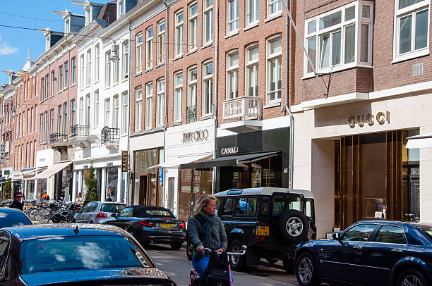 The P.C.Hooftstraat fashion street with the row of world’s brands. Amsterdam, the Netherlands - April 30, 2015: The P.C.Hooftstraat fashion street with the row of world’s biggest brands on April 30 ,2015, people on the street. victoria beckham stock pictures, royalty-free photos & images