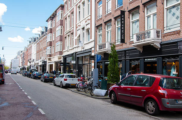 The P.C.Hooftstraat fashion street with world’s biggest brands, luxury clothes. Amsterdam, the Netherlands - April 30, 2015: The P.C.Hooftstraat fashion street with world’s biggest brands, luxury clothes, people on the street. victoria beckham stock pictures, royalty-free photos & images