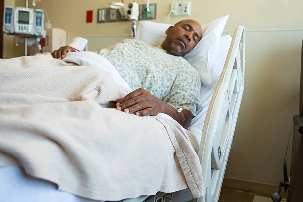 istock Man in hospital bed 493539041