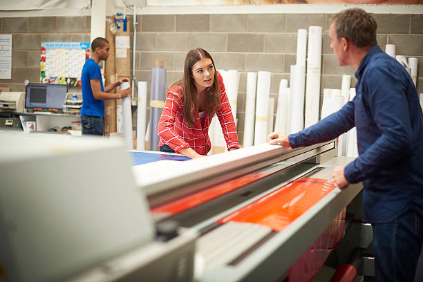 istock woman working at a signage company 493539584